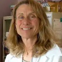 smiling female veterinarian with shoulder length blonde hair